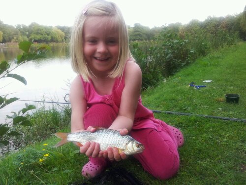 My daughter's first of three fish that she caught
