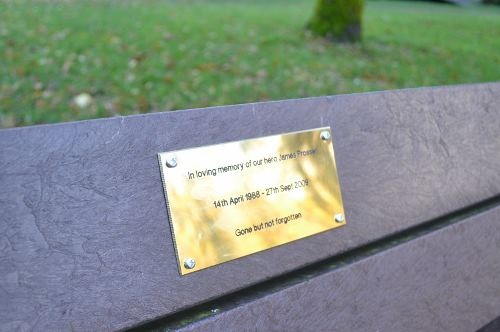 The plaque on the bench