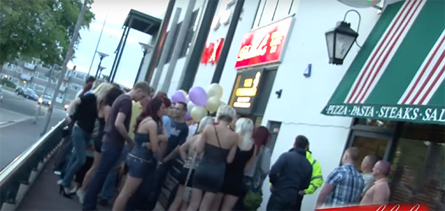 a queue of people for a nightclub