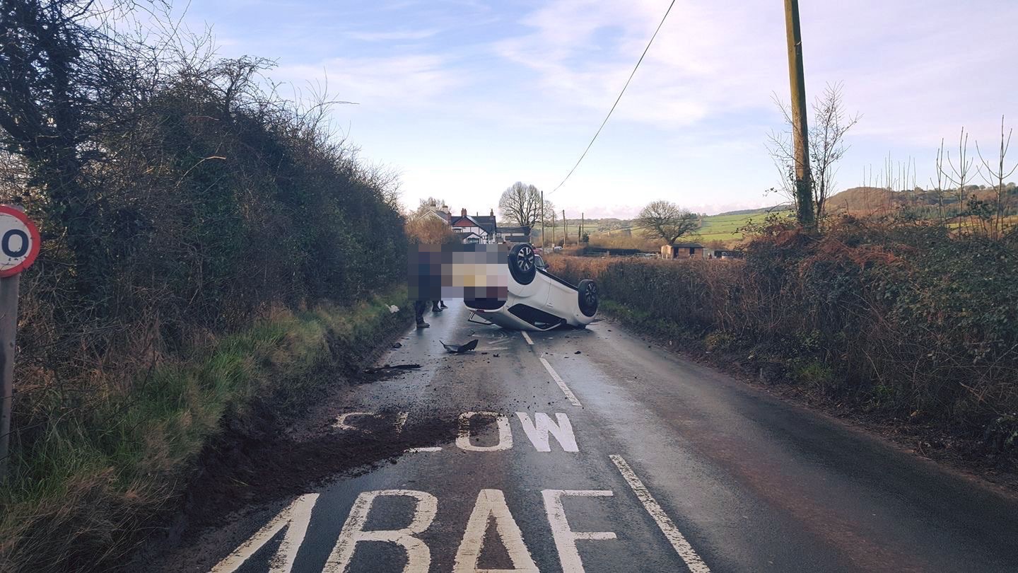 An overturned car in the lane between Cwmbran and Fourteen Locks