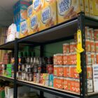 tins and cereal on shelves