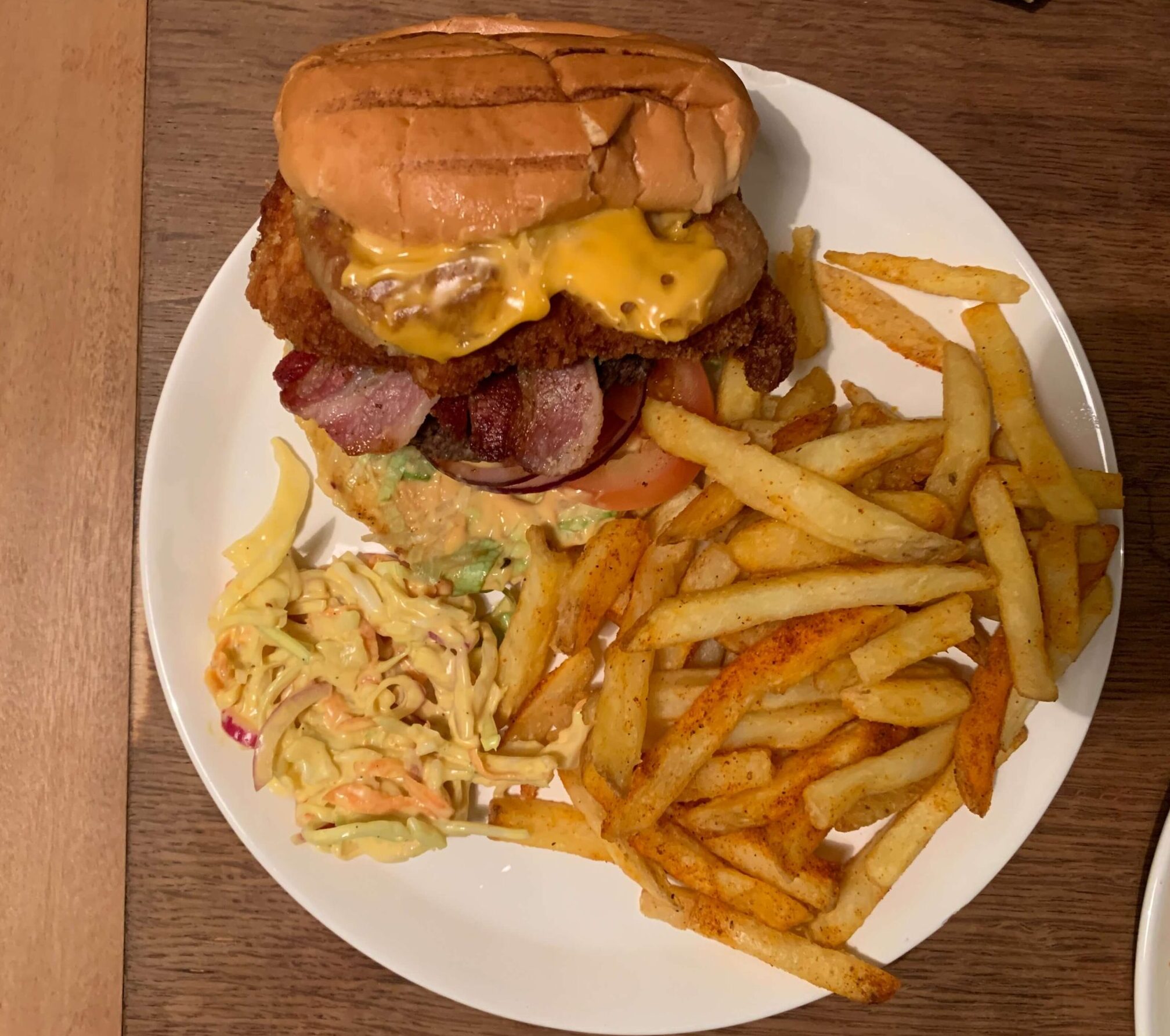 a burger and chips on a plat