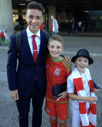 James Chester with two Welsh football fans