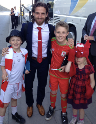 three children with footballer Joe Allen