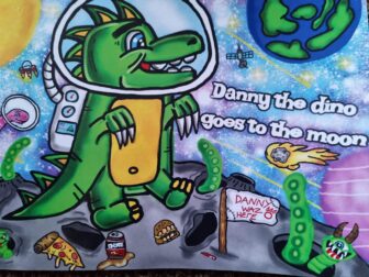 the front cover of children's book- Danny The Dino Goes the Moon