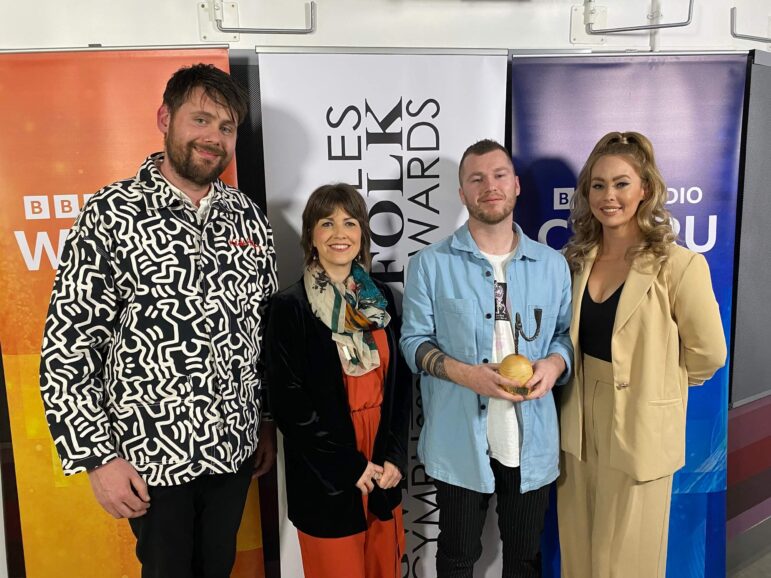 four musicians stood with their award