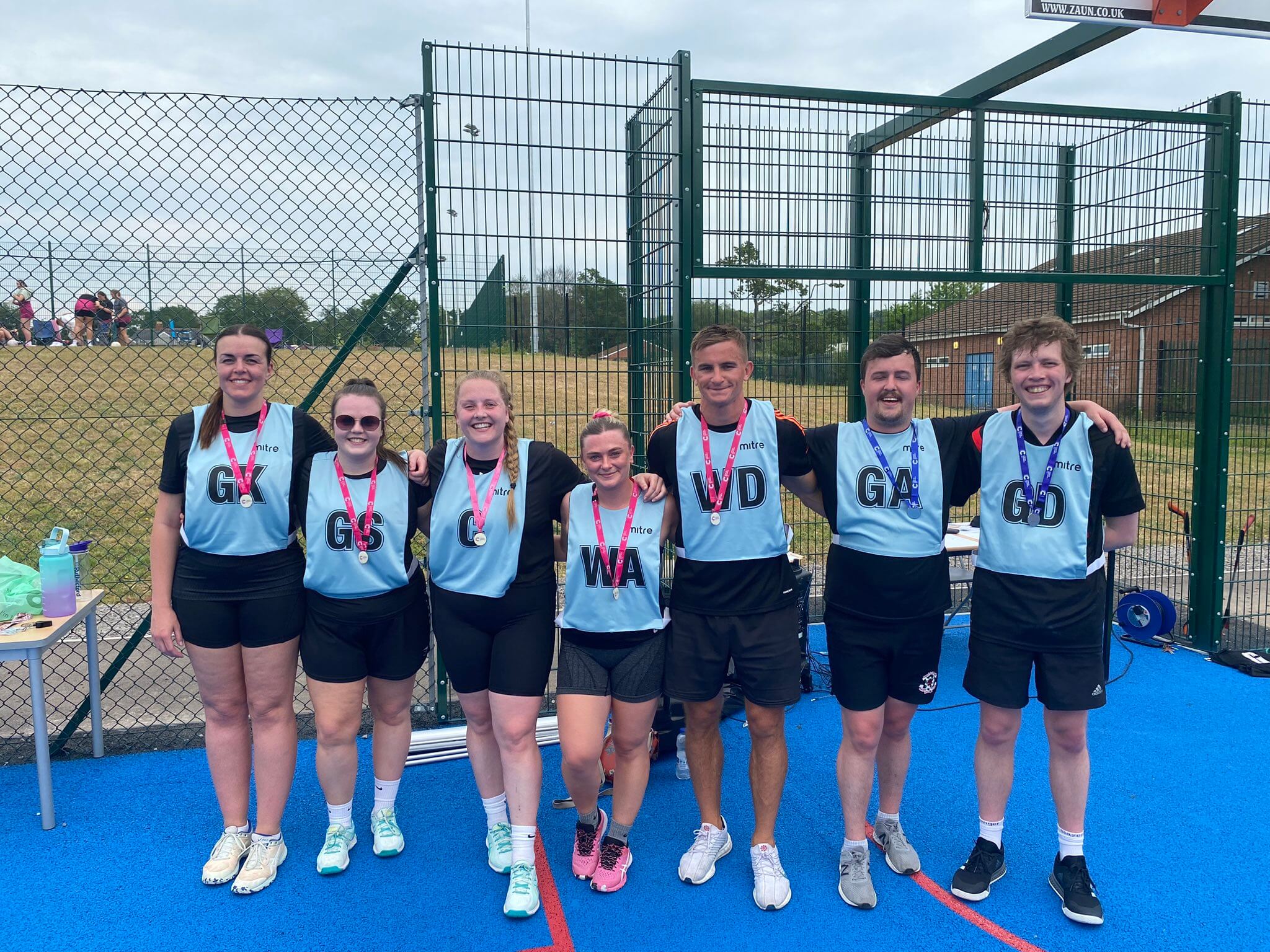 a team of male and female netball players