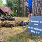 a sign against a tree for The P Commando RN Re-enactment Group