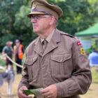 a man dressed in military uniform at a re-enactment event