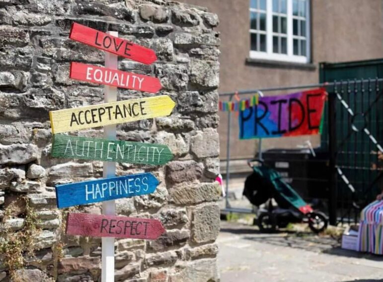 colourful signpost at a pride event