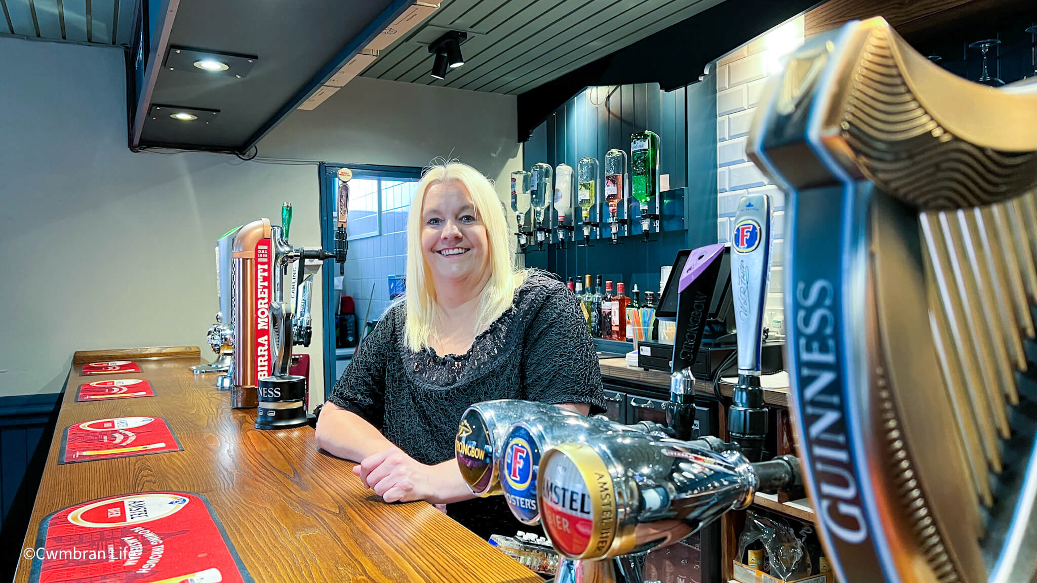 Nic Bullimore, landlady, at the bar of the Six in Hand