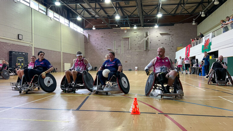 a wheelchair rugby player about to cross the line