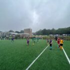 a junior football match on an all weather pitch
