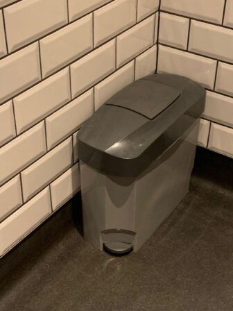 A sanitary bin in a toilet