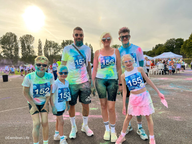 a family covered in powder paint