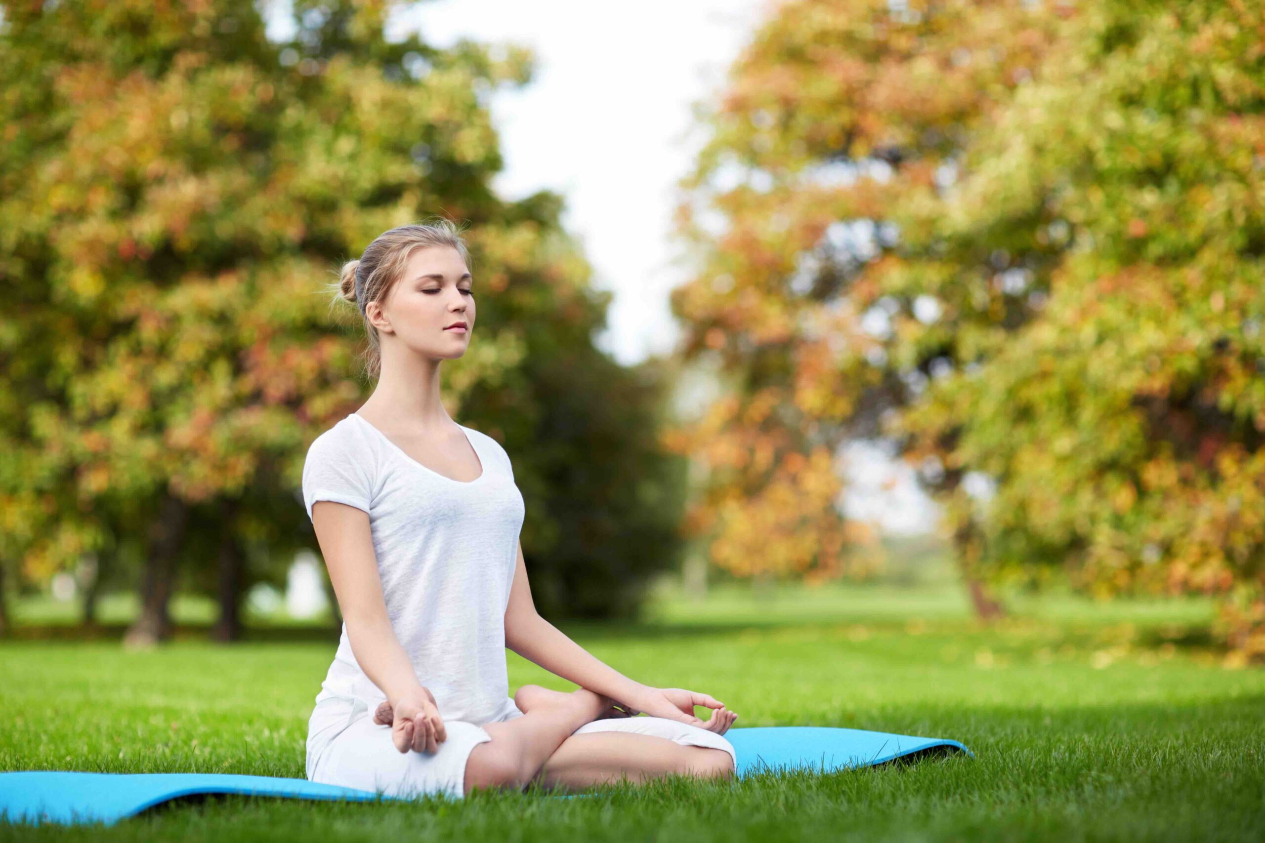woman doing yoga in the park