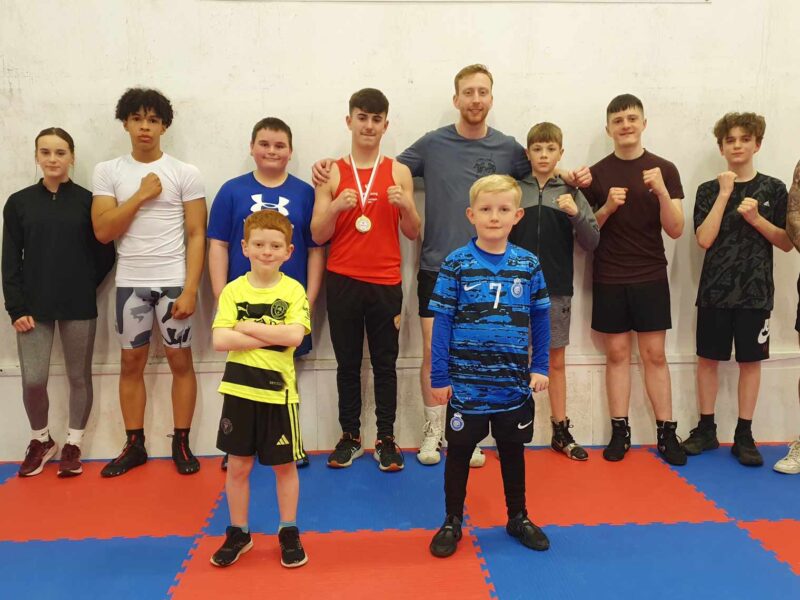 a group of young boxers in a gym