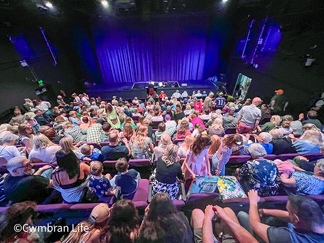 an audience in a theatre