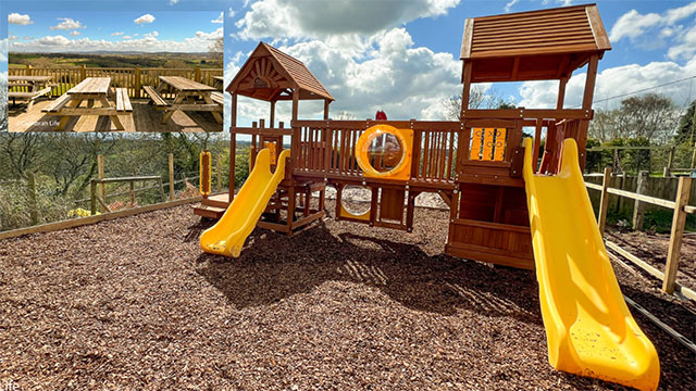 a play park and decking viewing area looking over countryside