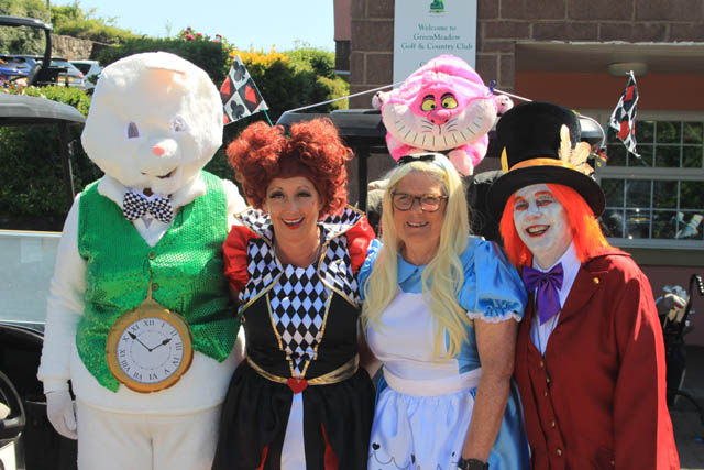 four women dressed as alice in wonderland character
