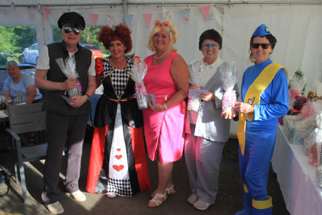 five golfers dressed in fancy dress