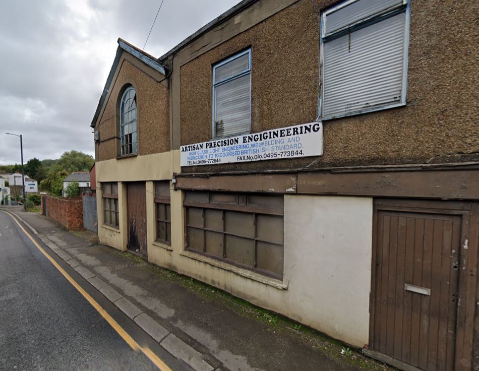 the outside of a disused workshop