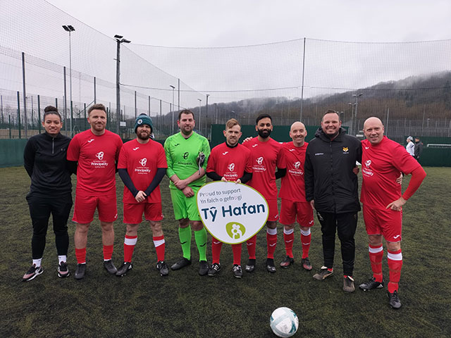 a football team line up on a pitch