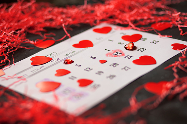 a calendar with hearts dotted around it