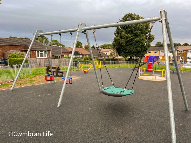 a set of swings in a playground