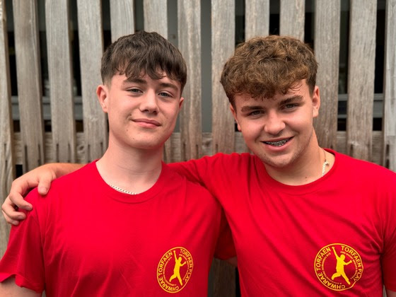 two young men in red t-shirts