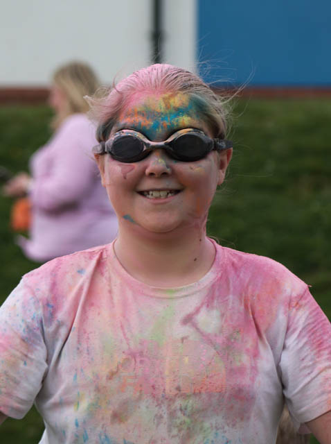 a girl covered in powder paint