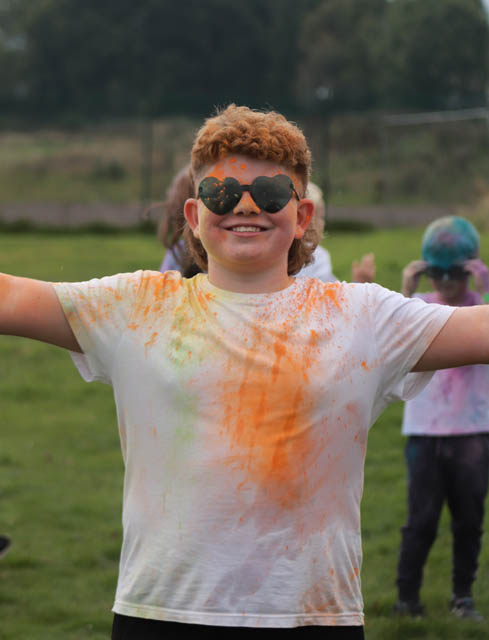 a boy covered in powder paint