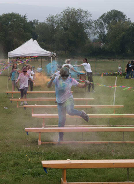 children run over benches on an obstacle course