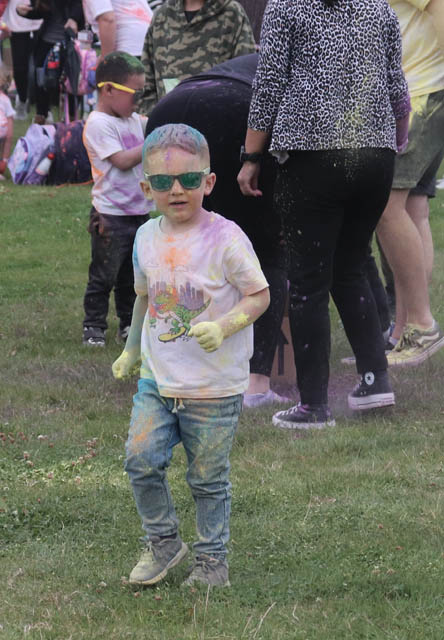 a boy covered in powder paint