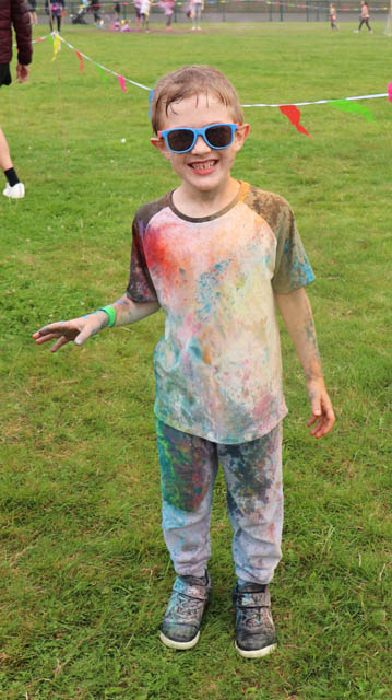 a boy covered in powder paint