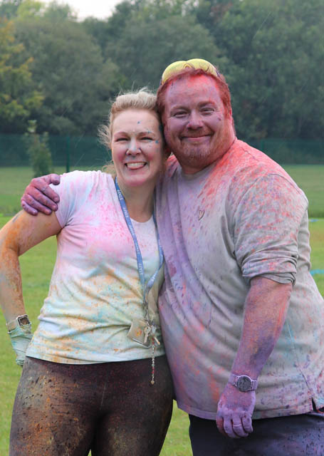 a man and a woman covered in powder paint