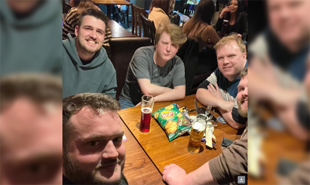 Five men a a pub table with drinks