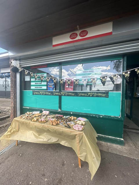 cakes on a table outside a post office