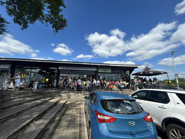 people outside a local shopping centre