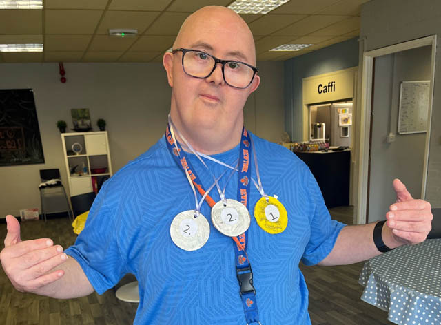 a man wearing three medals