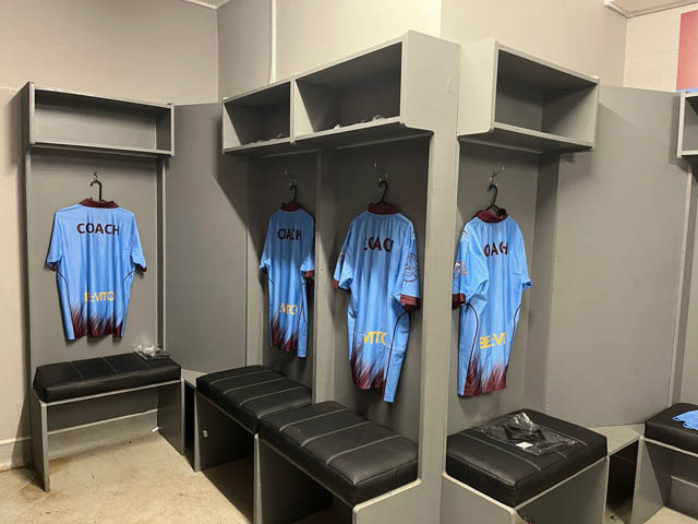 football shirts hanging in a changing room