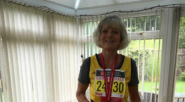 Jane with her medal from a previous Cardiff Half Marathon