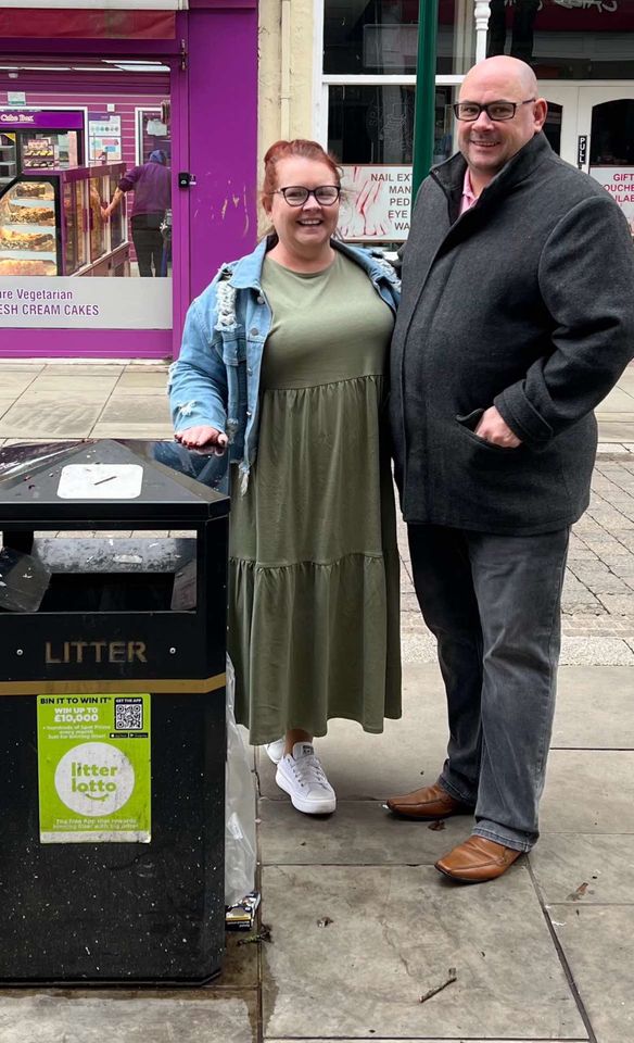 Keri and darryl stood by the bin in Newport