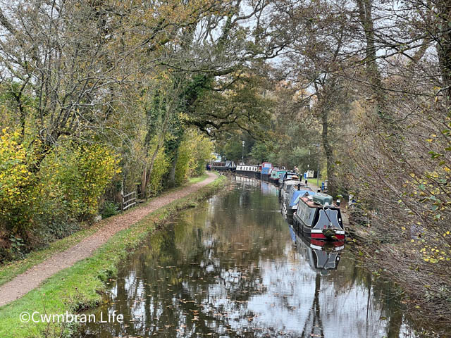 a canal with several barges