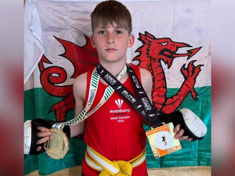 wearing his Welsh boxing vest and holding his World Jiu-Jitsu gold medals.