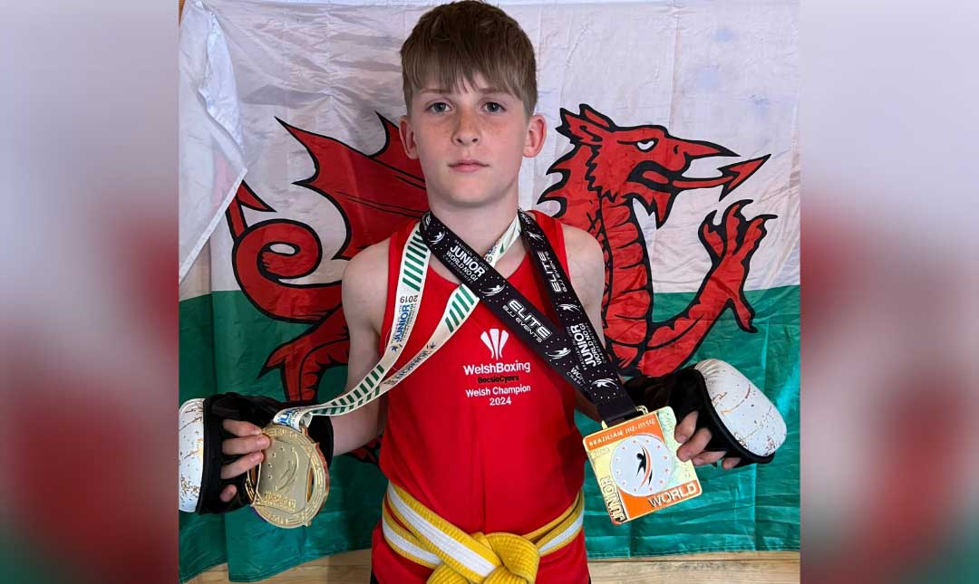 wearing his Welsh boxing vest and holding his World Jiu-Jitsu gold medals.