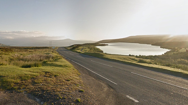 A view showing the B4246 passing Pwll Pen-ffordd-goch locally known as Keeper's Pond north of Blaenavon.