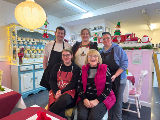 Lesley (front right) with her staff in Trios Cafe