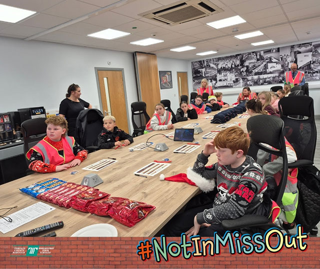 Pupils in the boardroom at Burton's Biscuit factory in Cwmbran