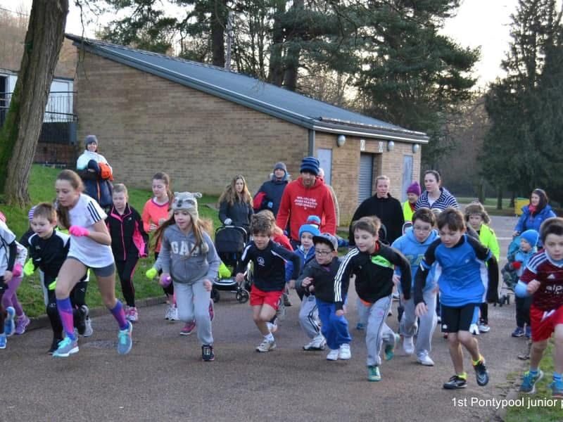 young runners cross a start line